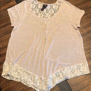 Ladies top with lace embellishment.